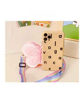 Size comparison of butterfly silicone crossbody bag next to a mobile phone