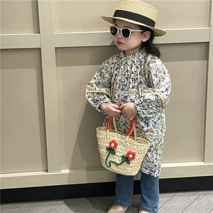 Girl's woven basket bag with red flower detail for summer beach and pastoral style outfits