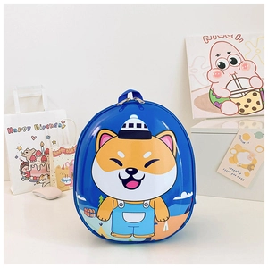 Detail of cute Shiba Inu character printed on durable blue hardshell kids backpack