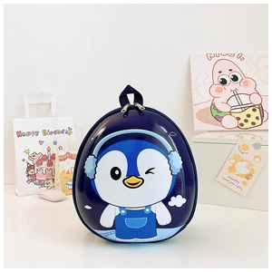 Close-up of cute blue penguin egg-shell backpack with waterproof hard shell surface