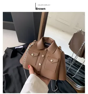 Detail of creative brown jacket-shaped crossbody bag with silver chain strap and leather texture