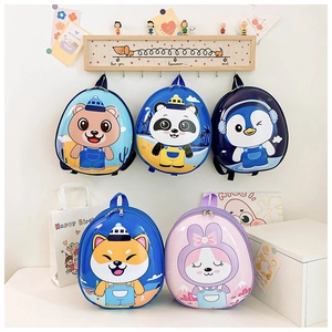 Detail of five cute egg-shaped kids backpacks featuring bear, panda, and penguin designs