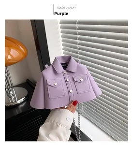 Detail of creative purple shirt-shaped mini bag with metallic chain and PU leather