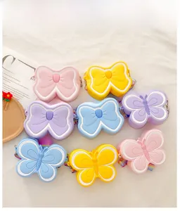 Detail of colorful butterfly silicone coin purses with macaron colors and woven straps