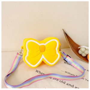 Detail of yellow silicone butterfly crossbody bag for kids with rainbow shoulder strap