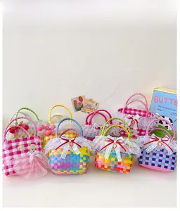 Close-up of woven girls' handbags with colorful plaid patterns and delicate lace edges