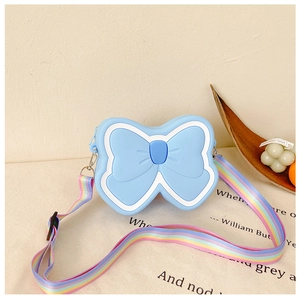 Detail of light blue silicone butterfly bag with colorful rainbow adjustable shoulder strap