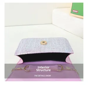 Macro view of purple sequin mini bag interior showing magnetic clasp and chain ring