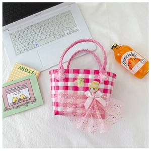 Detail of pink and white checkered woven basket bag with princess applique and sequins