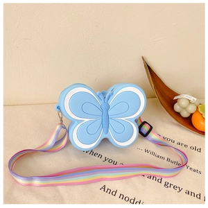 Detail of blue butterfly silicone purse featuring a colorful rainbow adjustable strap