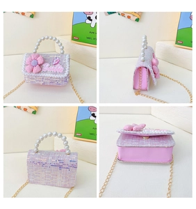 Detail of pink tweed girl bag with pearl handle and sparkly flower decoration