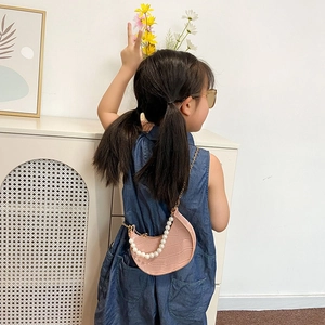 Pink crescent kids handbag with faux crocodile leather, pearl handle and metal chain