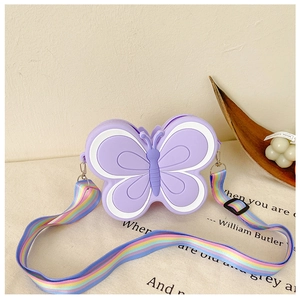 Detail of purple butterfly silicone bag with adjustable rainbow gradient woven strap