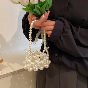 Elegant beaded pearl handbag for girls featuring a unique woven spherical cluster design