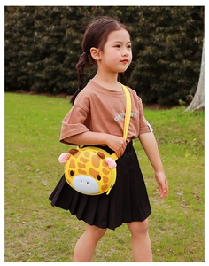 Detail of cute yellow cartoon giraffe crossbody bag with adjustable nylon strap for kids