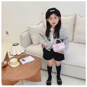 Pink sequin mini handbag with floral detail and pearl handle for a child's stylish look