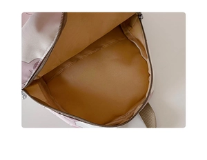 Detailed interior of a cute bear print canvas backpack with neat lining and quality zippers