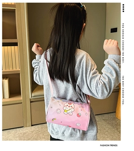 Cute pink cylinder cartoon crossbody bag for girls with rabbit print worn by model