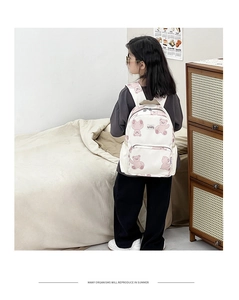 Detailed view of lightweight canvas kids backpack with cute pink cartoon bear print