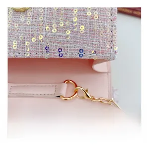 Detail of pink sequin tweed girl's bag with detachable gold chain hook and smooth lining