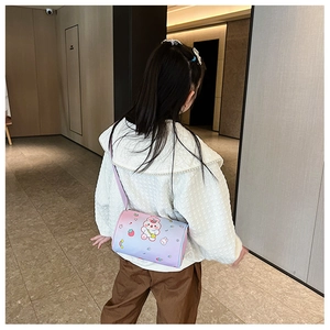 Rear view of a girl wearing a gradient pink cartoon rabbit round crossbody bag with strap