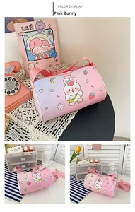 Detail view of pink rabbit printed canvas cylinder bag with lucky strawberry pattern