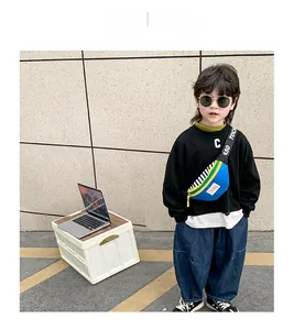 Kids streetwear crossbody bag in blue and yellow colors worn by a child in an outdoor setting