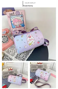 Detail of cute purple gradient cylinder bag featuring cartoon rabbit and strawberry prints