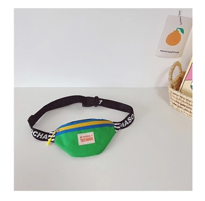 Detail of color-block kids crossbody bag with green blue and yellow nylon panels