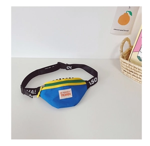 Detail view of colorful kids crossbody bag with yellow zipper and blue contrast fabric