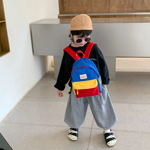 Kids lightweight canvas backpack with vibrant red, yellow, and blue color blocking
