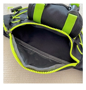 Close-up of kids' nylon sling bag showing neon green zipper and spacious main compartment