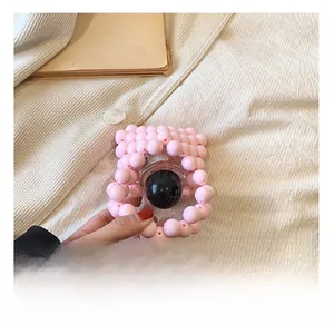Detailed view showing the inner storage capacity of pink beaded mini bag for girls