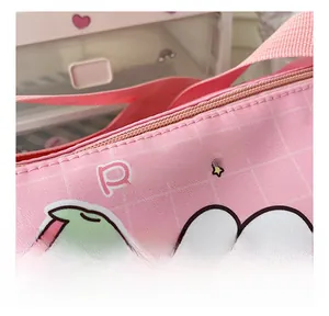 Detail shot of the smooth pink metal zipper and Rabbit print on canvas toddler bag