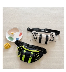Detail of trendy kids canvas chest bag with tactical buckle and contrast neon accents
