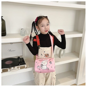 Pink canvas cylinder bag with cartoon bunny print and adjustable strap for girls