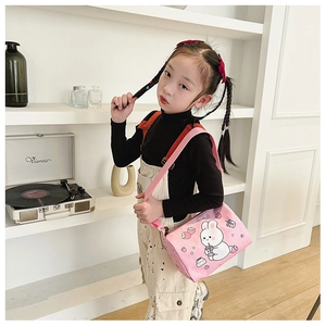 Pink canvas kid's shoulder bag featuring cute cartoon rabbit and strawberry prints