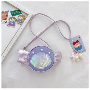 Detail of purple sequin candy-shaped girls crossbody bag with shell and pearl accents