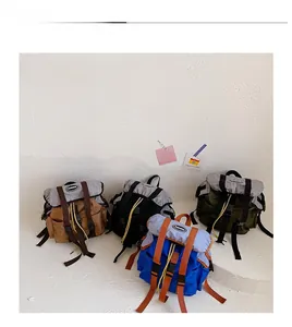 Detail display of four drawstring backpacks in brown black green and blue colors