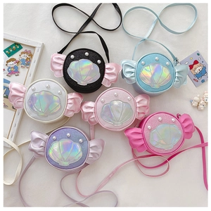 Detail of colorful sequin children's handbags with glitter shell patches and pearl decor
