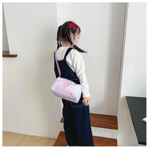 Detail of purple cartoon mermaid canvas barrel bag for girls with adjustable strap