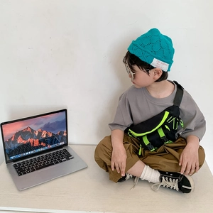 Cool boy's fashion outfit with canvas cross-body waist bag in green and black contrast colors