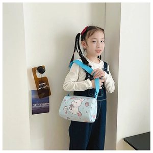 Detail of cute rabbit canvas crossbody bag shown on a young girl in a bright setting