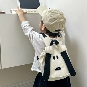 Cute cartoon puppy toddler backpack in cream canvas with black straps for kids