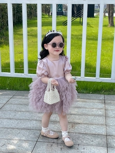 Girl's lavender tulle princess dress paired with elegant white pearl handle handbag
