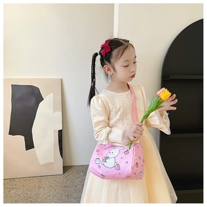 Pink cylinder canvas bag for girls featuring cute bunny print and adjustable strap