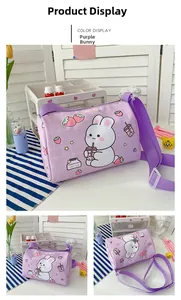 Detail of purple plaid cylinder canvas bag with cute cartoon rabbit and strawberry prints
