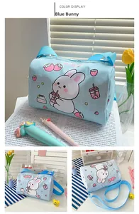 Close-up of cute light blue plaid canvas bag with cartoon rabbit and strawberry prints