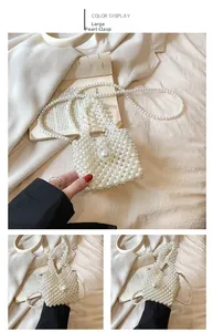 Detail view of woven pearl crossbody bag featuring a large decorative pearl buckle clasp