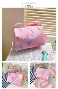 Pink canvas crossbody bag featuring mermaid illustration and smooth zipper detail